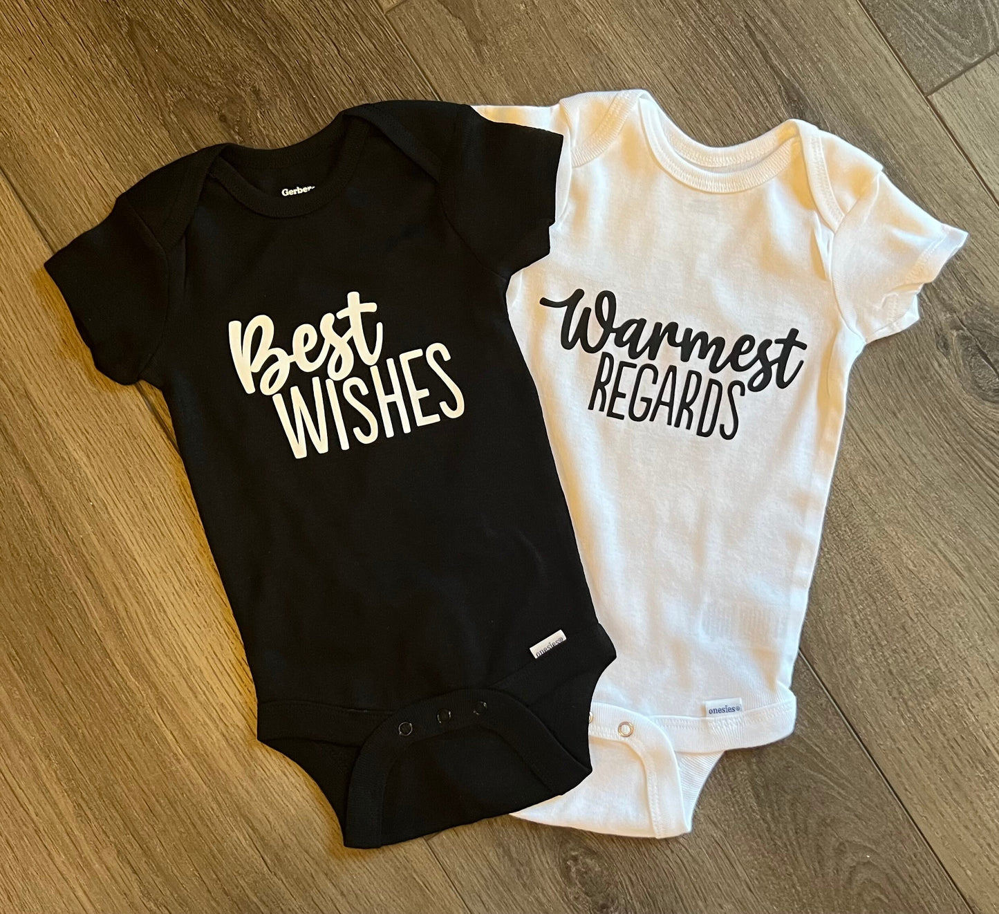 best wishes warmest regards on one black and one white baby onesie