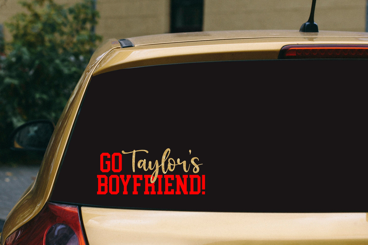 a car with a sticker that says go taylor's boyfriend