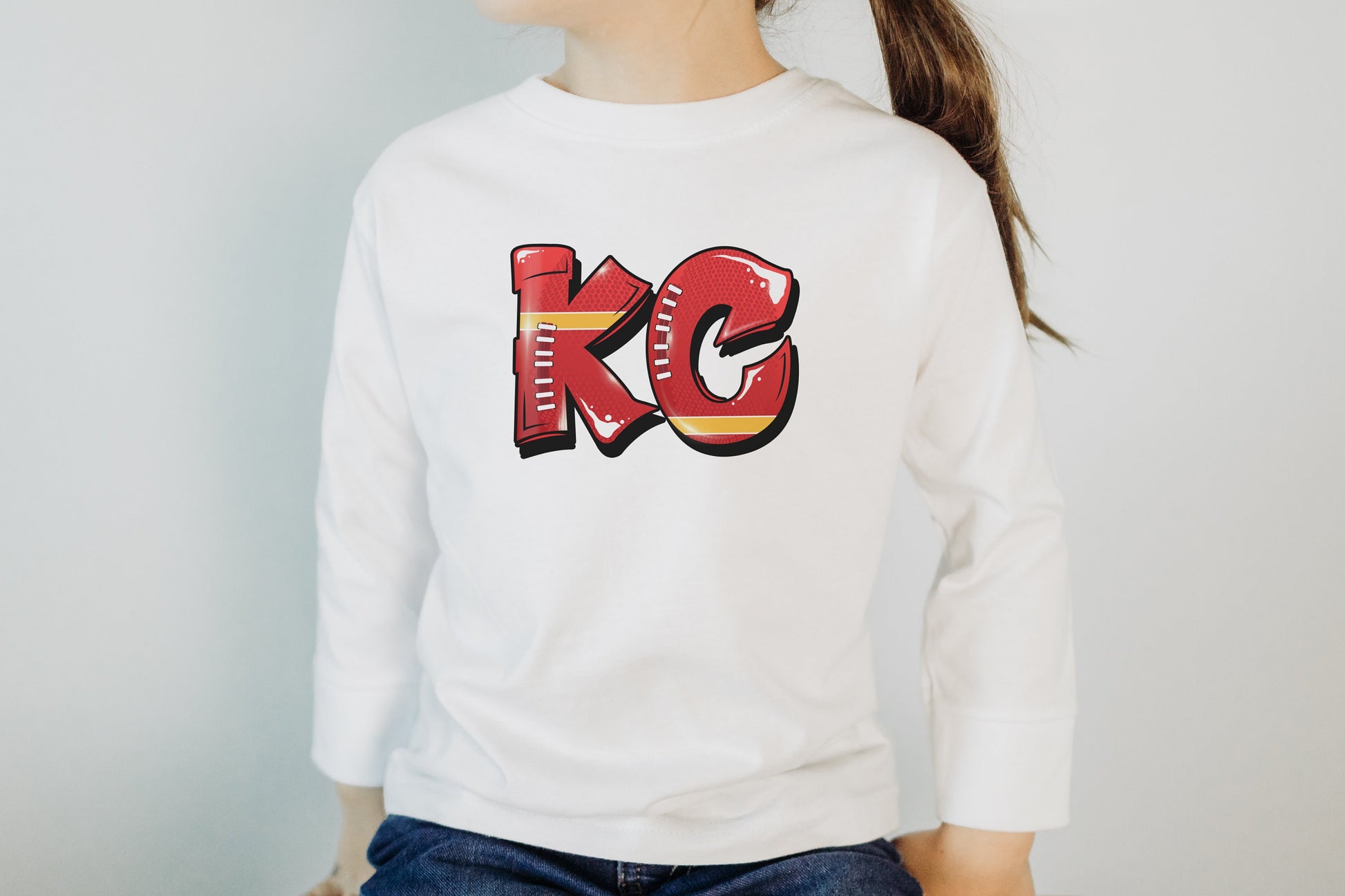 Graffiti KC | Made in Kansas City! | Toddler Kids Football at Arrowhead White Long Short Sleeve Shirt | Perfect for Game Day | Soft! | Youth