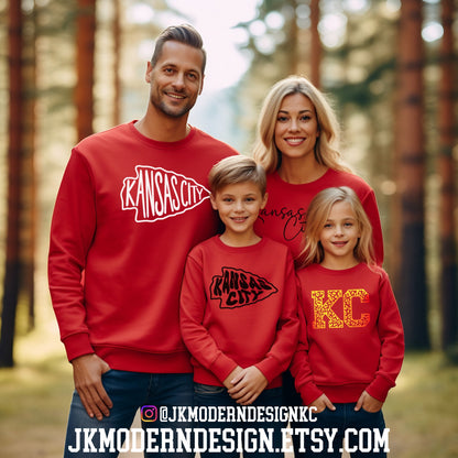 a family wearing matching red sweatshirts